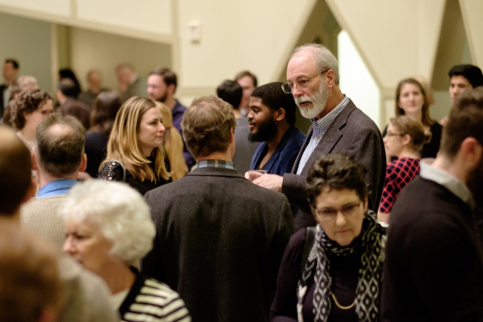 Guests in conversation after a lecture