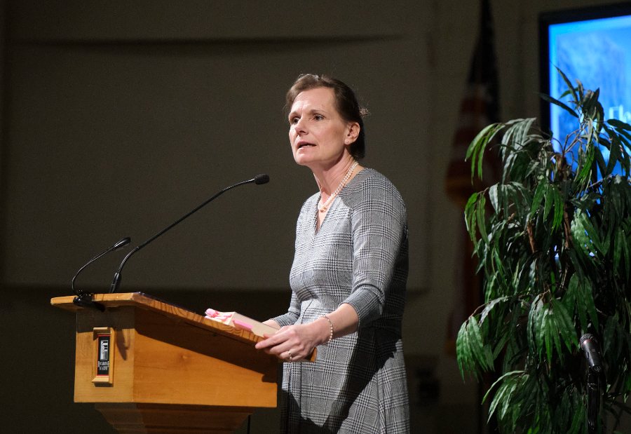 Carolyn Weber speaking at the podium